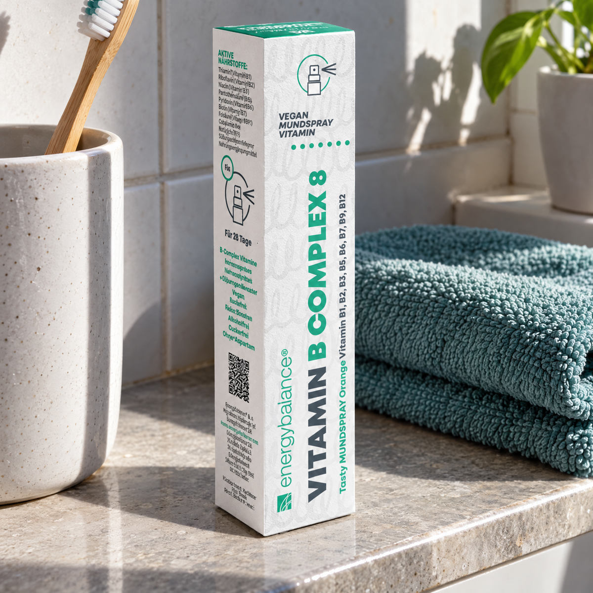 Energy Balance Vitamin B Complex 8 Mundspray 25 ml – auf einer Badezimmerablage mit Zahnputzbecher